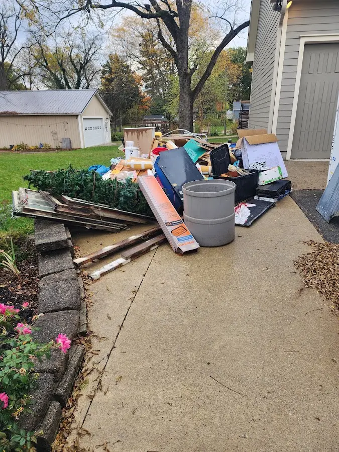 Dumpster being loaded with debris for 3 Yard Dumpster Rental in South Sioux City
